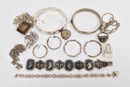 Silver hinged bangle with engraved decoration, Birmingham 1970, another hinged silver bangle with