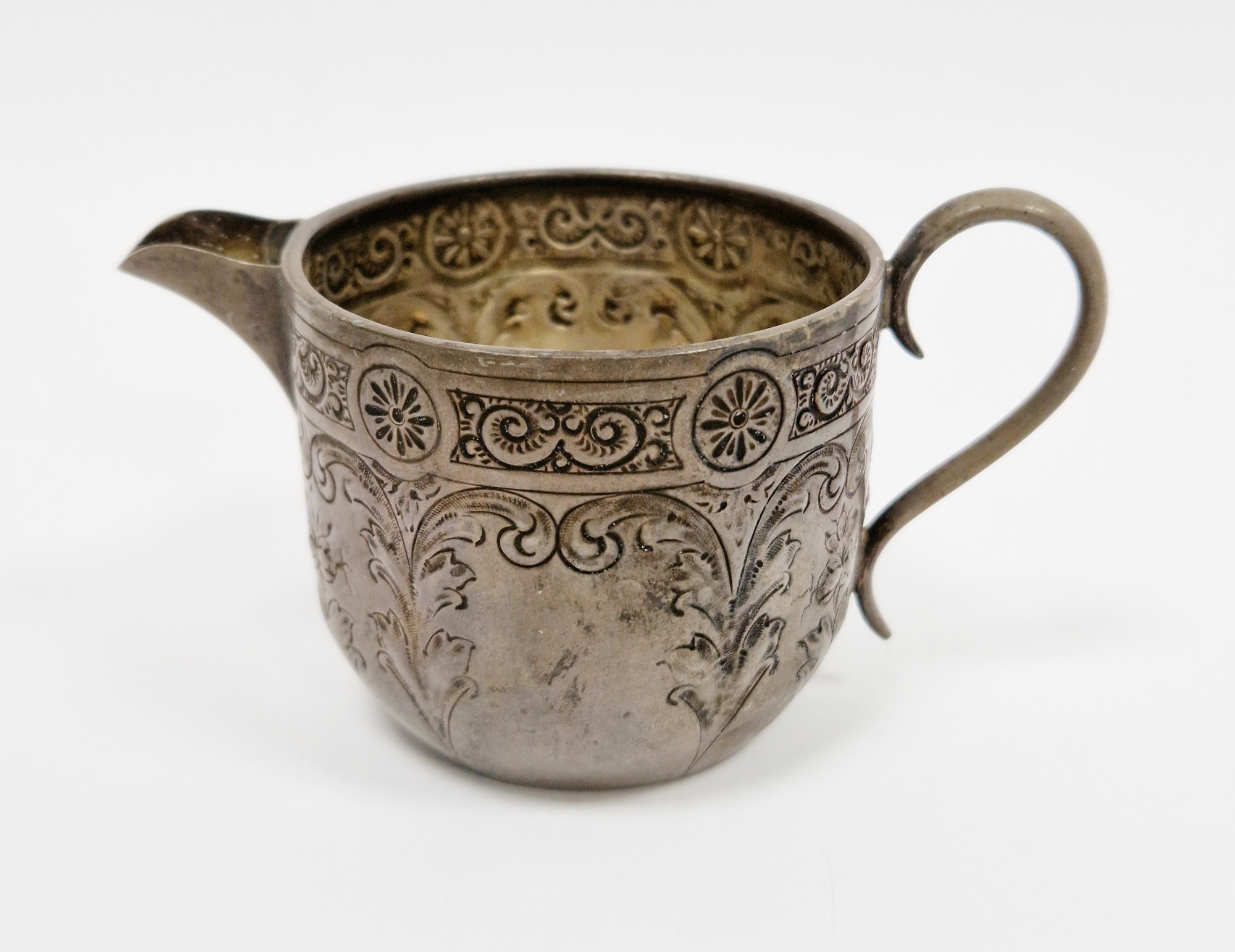 Victorian silver milk jug by Howell & James Ltd, Sheffield 1886, of circular form with engraved