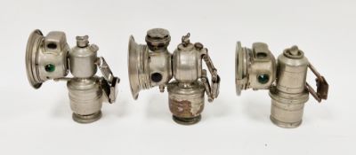 Three bicycle carbide lamps including a Powell and Hanmer Panther lamp, a Lucas Calcia Cadet lamp