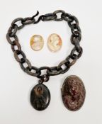 Victorian pressed horn necklace comprising an oval locket with monogram and a short belcher link