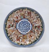 Japanese imari porcelain charger, Meiji period, painted with underglaze blue floral roundel to the