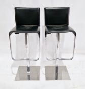 Pair of Italian design swivel bar stools, with black leather effect seats and back, on chrome effect