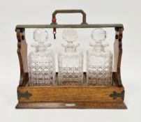 Victorian brass bound oak tantalus 'The Cabinet by Mappin & Webb', the patent plaque dated June