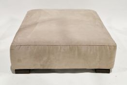 Contemporary Italian Natuzzi ottoman footstool of square form, upholstered in a cream suede type
