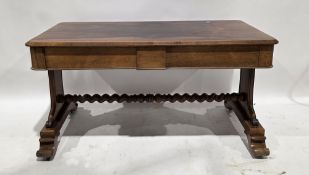 19th century rosewood library table, the rectangular top with round corners, over two blind frieze