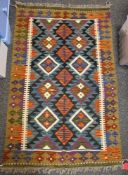 Maimana orange ground kilim with two rows of four lozenge medallions, single geometric border