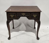 George II style oak kneehole side table or lowboy, the rectangular top with thumb moulded edge, over