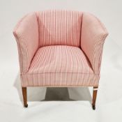Edwardian tub armchair upholstered in pink striped linen, on short square tapering mahogany supports