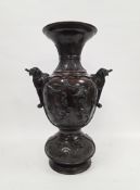 Large Japanese bronze Meiji period hall vase, with flared neck cast with radiating stiff leaves,