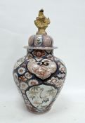 Japanese imari baluster vase and cover, Edo period, painted with panels of cranes and lion dogs,