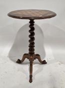 Mahogany and rosewood tripod table with carved floral decoration to the legs, twist stem and the