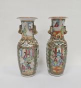 Two Chinese canton famille rose vases, late 19th century, painted with figures before terracing