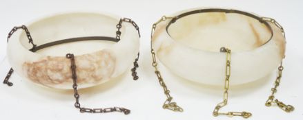 Pair of alabaster plafonnier ceiling lights of shallow circular form with brass mounts and chains,