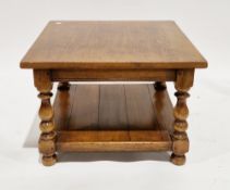 Oak square coffee table on turned baluster legs united by an undershelf, on bun feet, 48cm high x