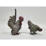 Japanese Okimono white metal alloy models of a cockerel and a hen, late Meiji/early 20th century,