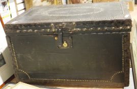 Black leather studded travelling trunk with label for J Lovells Trunk Manufacturer, Southampton,