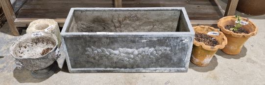 Lead-effect rectangular garden trough, a pair of ripple edged plant pots, a lead urn with iron