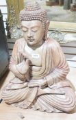 Contemporary stained carved wood model of a seated Buddha, in South East Asian-style (chipping to