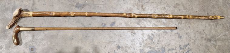 Antler-handled walking cane and another, brass inlaid (2)