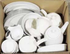 Three boxes of assorted ceramics including assorted white tableware and blue and white serving