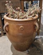 Terracotta amphora-style garden planter with four loop handles and moulded rim, 55cm high  Condition