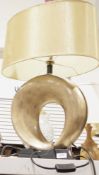 Contemporary table lamp, formed from a simulated gilt bronze style pierced pebble shape, with gold