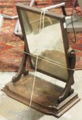 19th century mahogany mounted dressing table mirror, the swing mirror on scroll supports, on