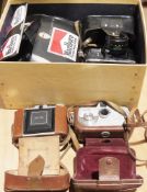 Collection of vintage cameras including a Zenit Moshva-80 EM camera with Helius 44m 2/58 lens, a