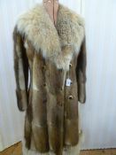 A Paul Magda fur coat, fox fur collar with its original Paul Magda hanger Condition Report This coat
