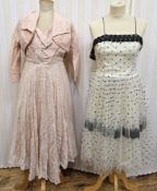 1950's/60's party dress in black net with black lace trim to the bodice and to the underskirt, a