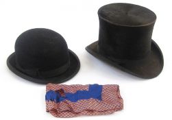 Black silk top hat labelled 'The Sherbourne Drapery and Outfitting Stores' (the hat has seen much
