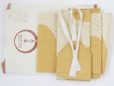 Japanese Obis in original wrappers to include gold-coloured, rust-coloured, black net printed with