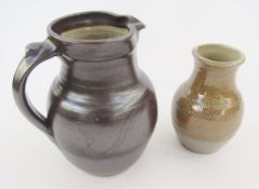 Ray Finch (1914-2012) for Winchcombe jug with tenmoku glaze, baluster shape with wave decoration,