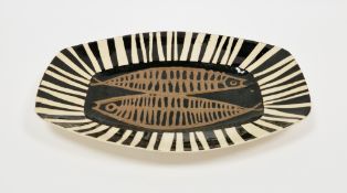 John Eaves (b.1929) A large studio pottery platter, of shaped rectangular form, slip decorated