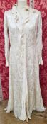1930's satin dressing gown, cut on the bias, with fabric button fastening, with a pattern printed of