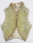 Child's Turkish-style waistcoat, wool lined with silk, heavily embroidered with gold thread