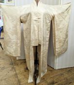 A mid-century wedding kimono, cream silk printed all over with cranes, which identify long life,