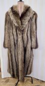 A full length vintage racoon coat, initials embroidered in the lining, shawl collar