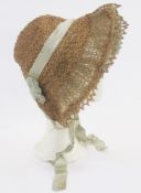 Mid/late 18th century poke bonnet, braided straw and threaded with ribbon, with pale blue chiffon