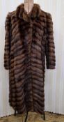 A vintage fur coat, 1940s, possibly wild sable, with diagonal stripes, full length, padded