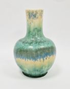A Ruskin crystalline glazed vase, mottled blue and green over yellow ground, impressed marks and
