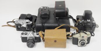 Collection of cameras and equipment including Asahi Pentax SP1000 camera, cased Zenit 12XP camera,