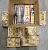 Collection of boxed silver plated kings pattern flatware including 12 knives, 4 serving spoons, 6