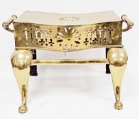 19th century brass and iron footman of serpentine form, pierced top and apron, twin handles, 28cm