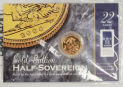 Elizabeth II 2000 gold bullion half sovereign, on original Royal Mint card and packet