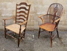 Antique elm and hardwood ladderback rush seated armchair, approx 116cm high, on turned supports