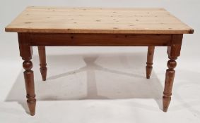 Pine kitchen table, of rectangular form on turned tapering legs, 78cm high x 136cm long x 80cm