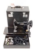 Singer 221K1 featherweight portable sewing machine by the Singer Manufacturing Co, serial no.