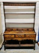 George III oak Welsh dresser, the open back plate rack comprising two shelves over a row of five