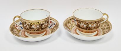 Pair of Spode imari pattern teacups and saucers, circa 1820, iron-red pattern no. 1009, each painted